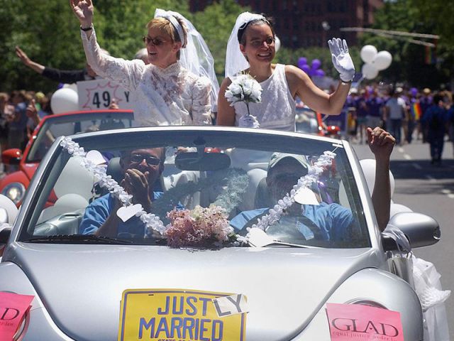 Moira Barrett (L) and Johanna Schulman, of Cambridge, ride in a car on June 12, 2004 during the 34th annual Boston Gay Pride Parade in Boston, Massachusetts. Getty Images