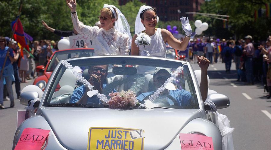 Moira Barrett (L) and Johanna Schulman, of Cambridge, ride in a car on June 12, 2004 during the 34th annual Boston Gay Pride Parade in Boston, Massachusetts. Getty Images