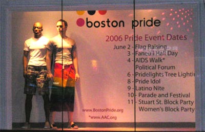 The original display in Macy's window, with two Male mannequins, one wearing a skirt, along side the 2006 Boston Pride logo and dates of events