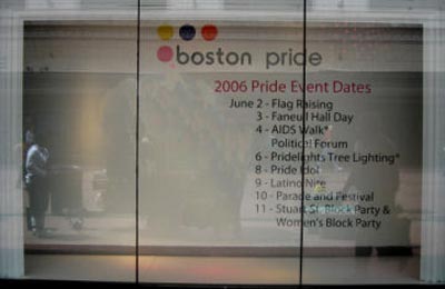 The Macy's window display, without the two male mannequins, one wearing a skirt, along side the 2006 Boston Pride logo and dates of events