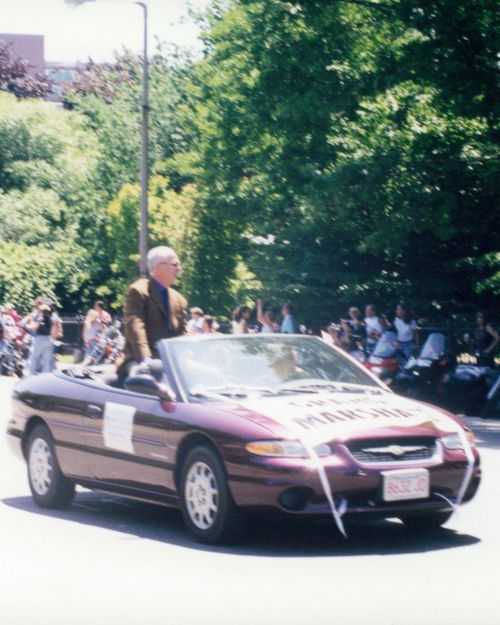 Grand Marshall Randy Price Sitting in a convertible going down Boylston St. during the 1999 pride parade in Boston