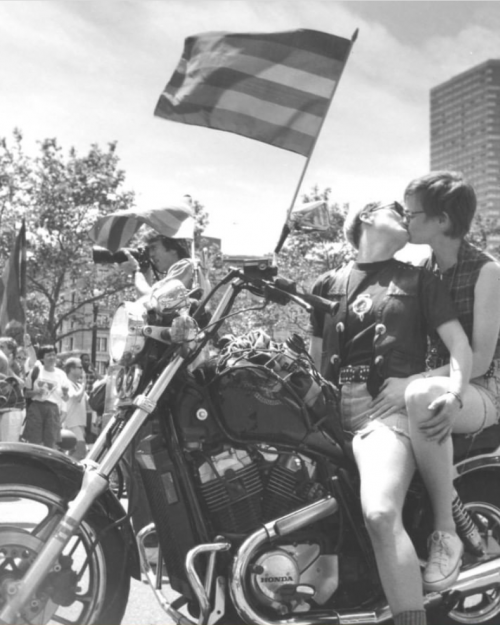 At the start of the 24th Annual Gay Pride Parade in Copley Square, Karen Perrine, left, kissed her girlfriend Beverly Sutherland. (Michele McDonald)