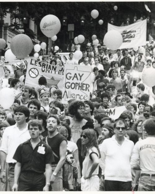 Marchers during the Gay Pride parade on Beacon Street. Credit: Wendy Madea/Boston Globe Staff