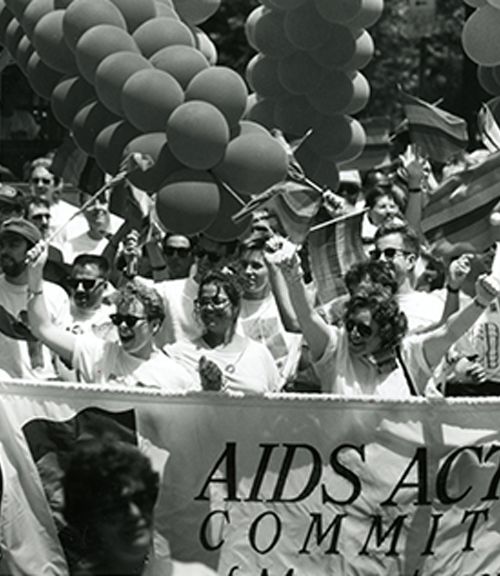 AIDS Action Committee makes its way down Deacon St during 1991 Gay Pride Parade. Credit: Boston Globe Staff, Wendy Maeda