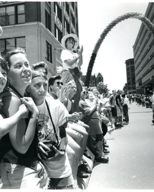 Maryah Sharpe, 8, with his MoM, Lee Centeno, with Suzanne Wakefield, from Portland, ME watch the parade as it goes up Dartmouth St. Are giant rainbow arch flies about the street during the 1993 Gay Pride Parade. Credit: Suzanne Krieter/Boston Globe Staff