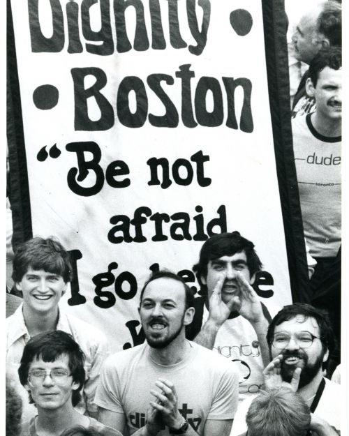 A few men from Dignity Boston in front of a sign that reads "Dignity Boston, Be not afraid, I go before you." Gay Pride parade on Charles Street. Credit: Wendy Madea/Boston Globe Staff